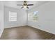 Airy bedroom with wood-look floors and large windows providing natural light at 1820 Salem Rd, Lakeland, FL 33803