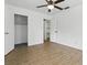 Spacious bedroom featuring ample closet space and ceiling fan at 1820 Salem Rd, Lakeland, FL 33803