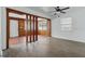 Open-concept living room with hardwood floors, ample natural light, and a view into the adjacent room at 1820 Salem Rd, Lakeland, FL 33803
