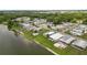 Scenic aerial view of a residential community along the water, showcasing the neighborhood layout at 1823 Blue Lake Dr, Lakeland, FL 33801