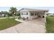 The home features an attached carport, offering convenient covered parking and protection from the elements at 1823 Blue Lake Dr, Lakeland, FL 33801
