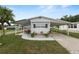 Charming single-story home with a carport and a well-maintained front lawn, perfect for relaxed outdoor living at 1823 Blue Lake Dr, Lakeland, FL 33801