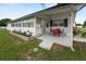 Inviting exterior with an outdoor seating area, ideal for enjoying the surrounding community views at 1823 Blue Lake Dr, Lakeland, FL 33801