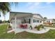 Home with outdoor space, perfect for relaxing and entertaining, complemented by lush landscaping and a cozy setting at 1823 Blue Lake Dr, Lakeland, FL 33801