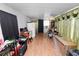 Multi-purpose living room with vinyl flooring, a desk area, and adaptable decor at 1823 Blue Lake Dr, Lakeland, FL 33801