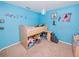 Charming blue bedroom with loft bed, carpet and decor at 1824 Baltic Pl, Lakeland, FL 33809