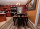 Cozy dining room features hardwood floors, decorative lighting, and elegant furniture at 1824 Baltic Pl, Lakeland, FL 33809