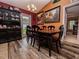 Cozy dining room features hardwood floors, decorative lighting, and elegant furniture at 1824 Baltic Pl, Lakeland, FL 33809