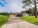 Charming single-story home with a driveway and a well-maintained front yard at 1824 Baltic Pl, Lakeland, FL 33809