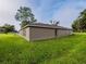 Exterior shot showing the rear of the home and the well-manicured backyard at 1824 Baltic Pl, Lakeland, FL 33809
