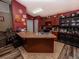 Open kitchen boasts an island with a sink and seating, plus ample cabinets and counter space at 1824 Baltic Pl, Lakeland, FL 33809
