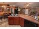 Open kitchen boasts an island with a sink and seating, plus ample cabinets and counter space at 1824 Baltic Pl, Lakeland, FL 33809
