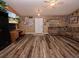 A spacious living room with wood floors, a ceiling fan, and modern decor at 1824 Baltic Pl, Lakeland, FL 33809