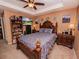 Spacious main bedroom with tray ceiling, comfy bedding, and warm lighting at 1824 Baltic Pl, Lakeland, FL 33809