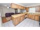 Spacious kitchen features a breakfast bar and a view into the living room at 1917 Lori W Ln, Lakeland, FL 33801