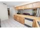 Spacious kitchen features a breakfast bar and a view into the living room at 1917 Lori W Ln, Lakeland, FL 33801