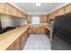 Traditional kitchen includes tile floors, ample cabinetry, and modern appliances at 1917 Lori W Ln, Lakeland, FL 33801