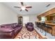 Open living room features a view into the kitchen breakfast bar at 1917 Lori W Ln, Lakeland, FL 33801