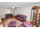 Comfortable living room featuring hardwood floors, ceiling fan, and a decorative rug at 1917 Lori W Ln, Lakeland, FL 33801