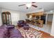 Open living room features a view into the kitchen breakfast bar at 1917 Lori W Ln, Lakeland, FL 33801