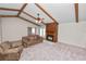Bright living room with a fireplace and exposed ceiling beams at 1917 Lori W Ln, Lakeland, FL 33801