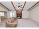Bright living room with a fireplace and exposed ceiling beams at 1917 Lori W Ln, Lakeland, FL 33801