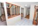 Open-concept living room with a fireplace, beamed ceiling, and half wall at 1917 Lori W Ln, Lakeland, FL 33801