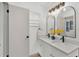 Bathroom with double sinks, updated mirrors and lighting at 1920 Kimball S Ct, Lakeland, FL 33813