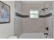 Beautiful bathroom with white subway tile, black accent stripe, and bronze hardware at 1920 Kimball S Ct, Lakeland, FL 33813