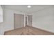 Neutral bedroom features a double closet, neutral walls, neutral carpet and access to other rooms at 1920 Kimball S Ct, Lakeland, FL 33813