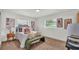Cozy bedroom with neutral tones, plush bedding, and ample natural light at 1920 Kimball S Ct, Lakeland, FL 33813