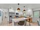 Bright kitchen featuring quartz countertops, stainless appliances and a breakfast bar at 1920 Kimball S Ct, Lakeland, FL 33813