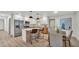 Eat-in kitchen featuring stainless steel appliances, stone countertops, and stylish pendant lighting at 1920 Kimball S Ct, Lakeland, FL 33813