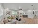 Bright living room with hardwood floors, contemporary furnishings, and plenty of natural light at 1920 Kimball S Ct, Lakeland, FL 33813