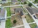 This home offers a spacious lot with an expansive yard, enclosed by a white fence at 2170 Forest Lake Ave, Dundee, FL 33838