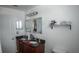 Bathroom featuring double sinks, granite countertops, and ample vanity space at 2170 Forest Lake Ave, Dundee, FL 33838