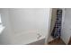 Bathroom with a garden tub and walk-in shower with neutral finishes at 2170 Forest Lake Ave, Dundee, FL 33838