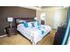 Comfortable main bedroom with dark wood furniture and stylish decor at 2170 Forest Lake Ave, Dundee, FL 33838