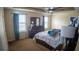 Bright main bedroom with large window, tray ceilings and decorative lighting at 2170 Forest Lake Ave, Dundee, FL 33838