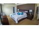 Spacious main bedroom featuring tray ceiling, ensuite bath and large closets at 2170 Forest Lake Ave, Dundee, FL 33838