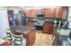 Well-equipped kitchen features stainless steel appliances, granite countertops, and tile flooring at 2170 Forest Lake Ave, Dundee, FL 33838