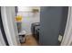 Efficient laundry room featuring modern washer and dryer, complemented by ample shelving for convenient storage at 2170 Forest Lake Ave, Dundee, FL 33838