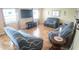 Cozy living room featuring tile flooring, large windows, and comfortable furniture at 2170 Forest Lake Ave, Dundee, FL 33838