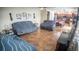 Spacious living room with tile flooring that opens into a dining and kitchen area at 2170 Forest Lake Ave, Dundee, FL 33838