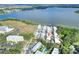 Birds-eye view of townhome community by the water's edge, highlighting the community's tranquil setting and convenience at 2203 Starboard, Winter Haven, FL 33881