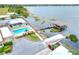 Aerial shot showcasing pool, boat dock, and waterfront access, all within a beautifully landscaped community at 2203 Starboard, Winter Haven, FL 33881