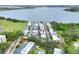 Aerial photo of well-maintained townhomes with community pool and mature trees close to scenic lake at 2203 Starboard, Winter Haven, FL 33881
