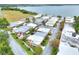 Aerial perspective of charming townhomes with well-kept landscaping near a peaceful lakeside setting at 2203 Starboard, Winter Haven, FL 33881