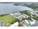 Aerial view of a lakeside community with well-maintained homes, mature trees, and beautiful lake views at 2203 Starboard, Winter Haven, FL 33881