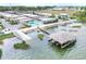 Overhead perspective reveals a community with pool, boat dock, and pristine waterfront at 2203 Starboard, Winter Haven, FL 33881